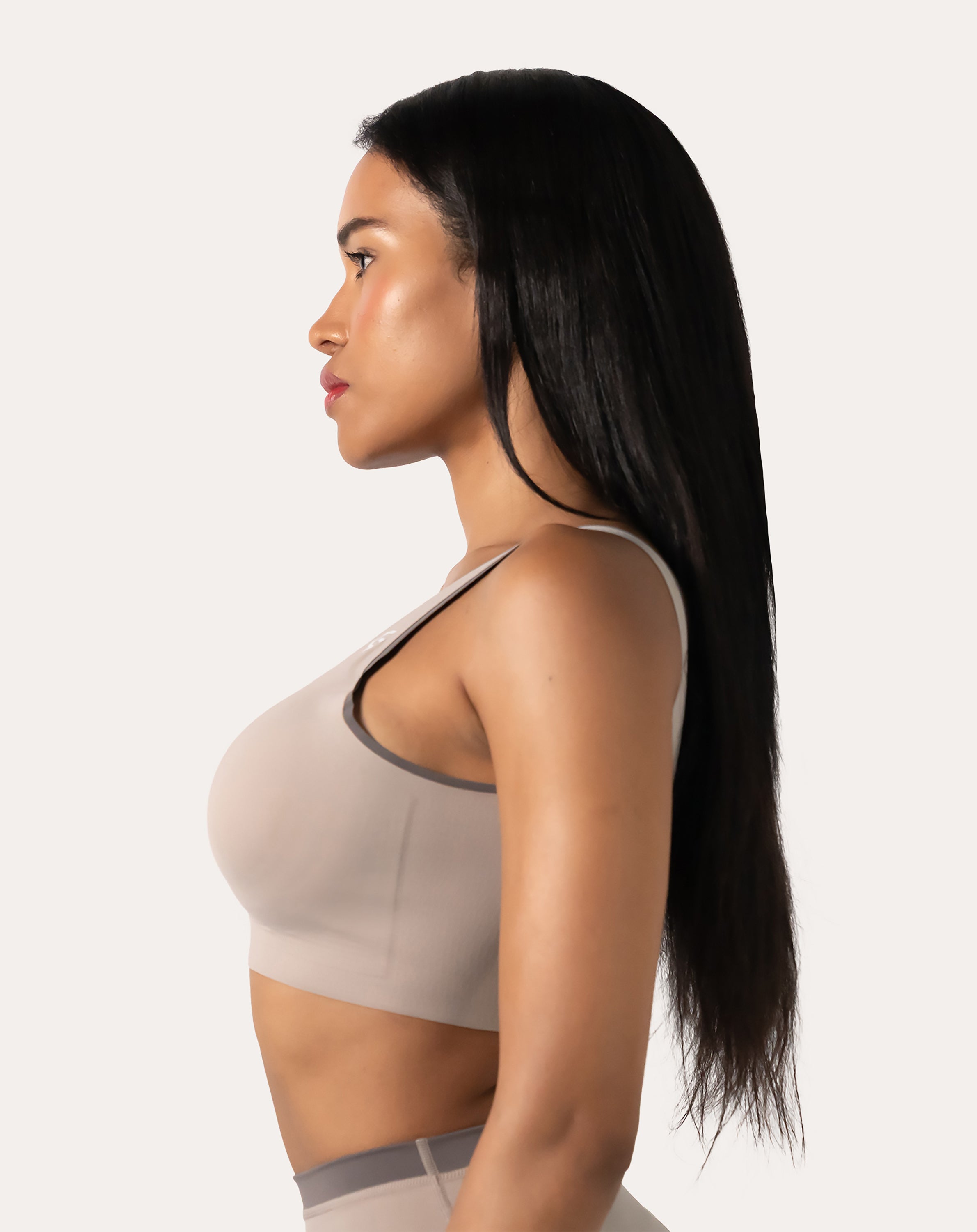 Beige high impact sports bra side profile showing wide straps and stabilising band