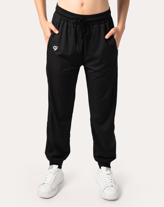 Front view of women’s black joggers showing high-waist, tapered legs and cuffed hems