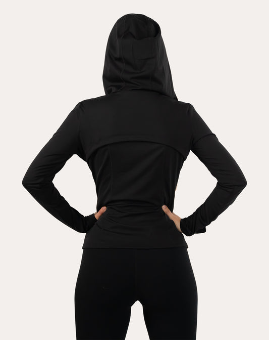 Back view of black women’s zip-up jacket with hood up and contoured seams