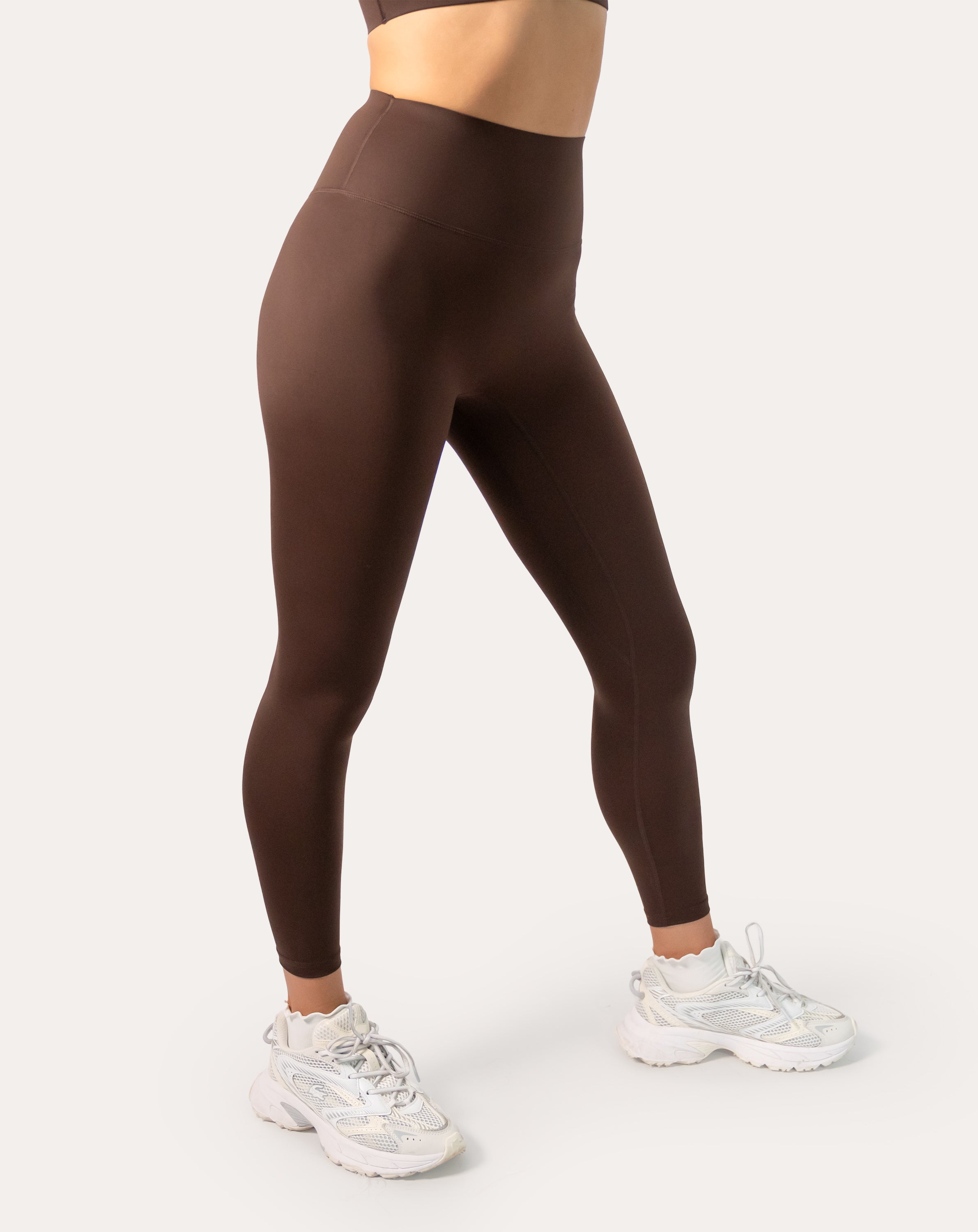 Chocolate brown sports leggings with high-rise waistband; right three quarter view