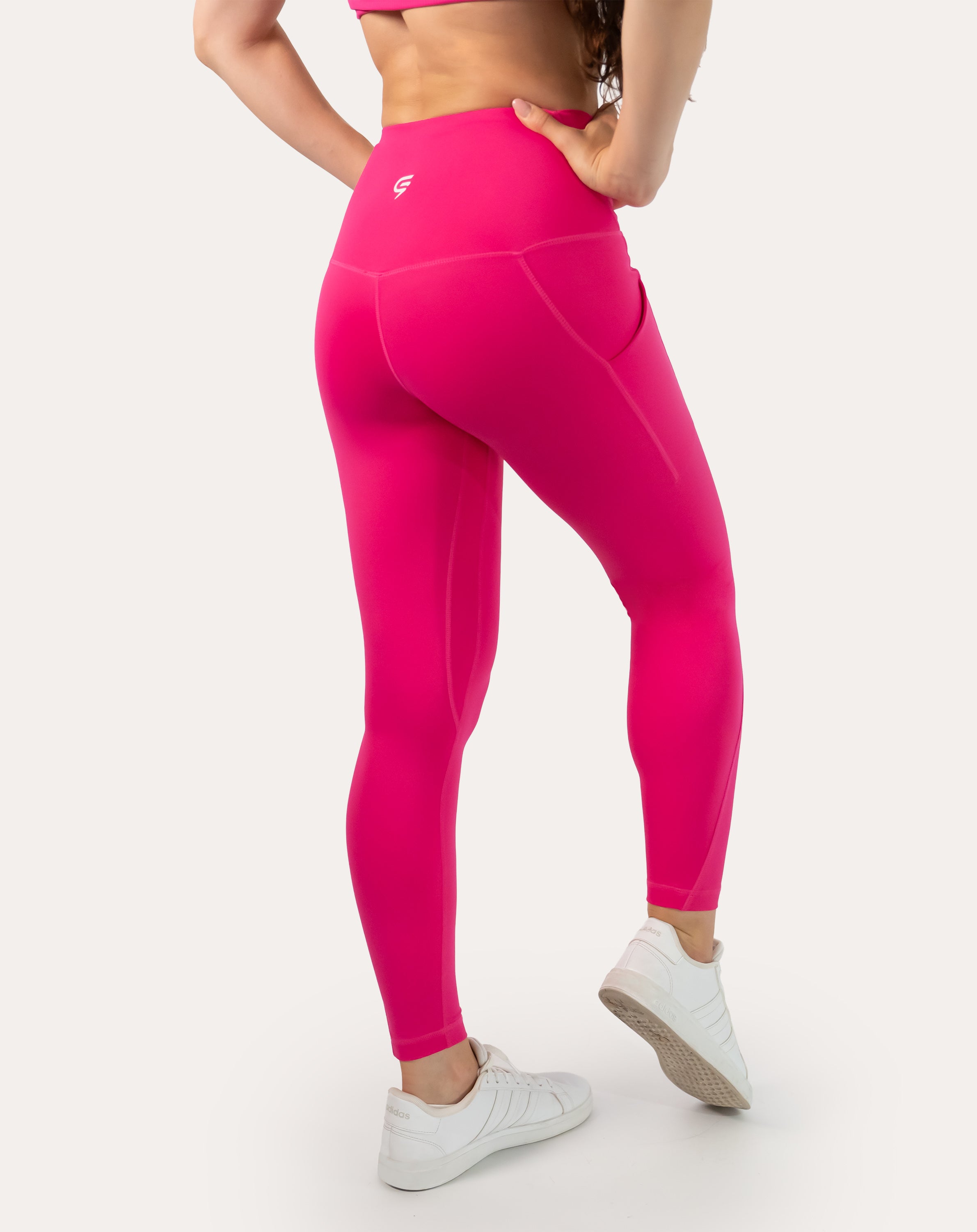 Hot pink running leggings with pockets; back view highlighting squat-proof seat
