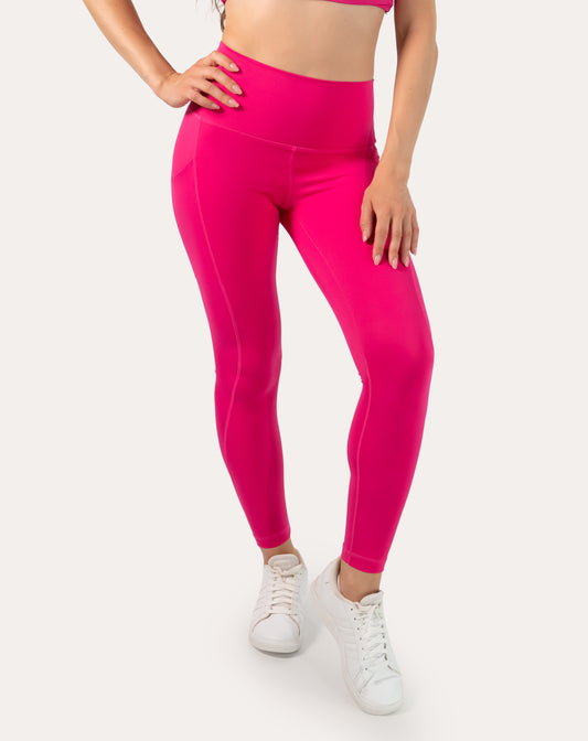 Hot pink running leggings with pockets; high-waisted front waist-to-ankle close-up