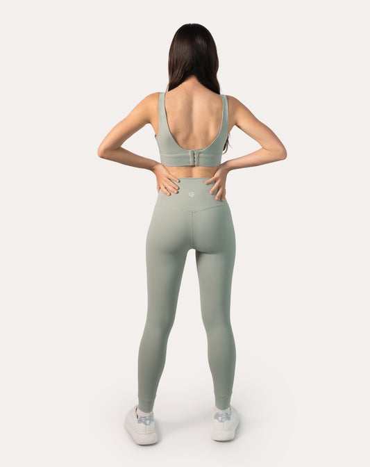 Back view of sage green gym set showing clasp-back sports bra and smooth seams