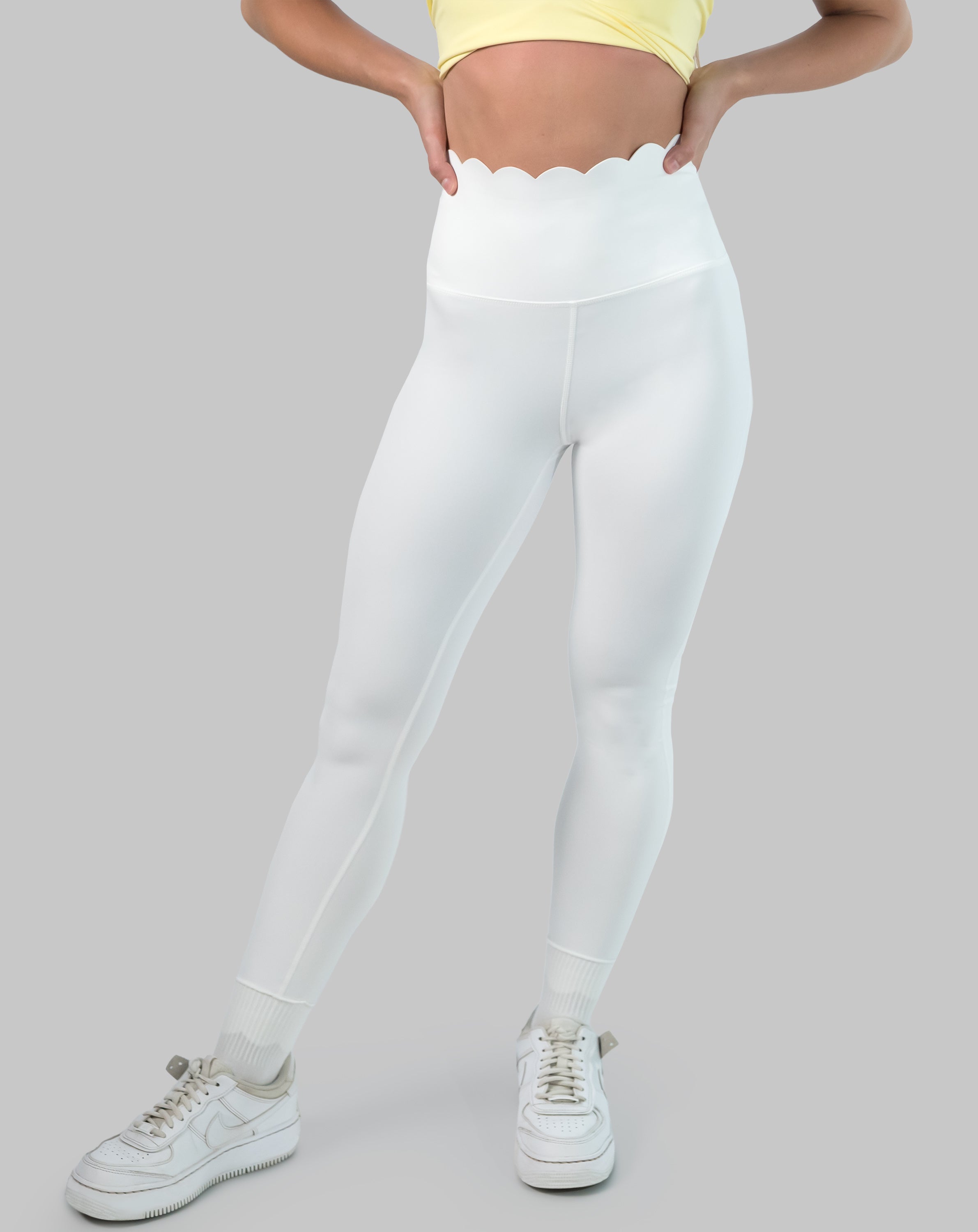 White leggings with high waisted scallop waistband, ankle length; front view