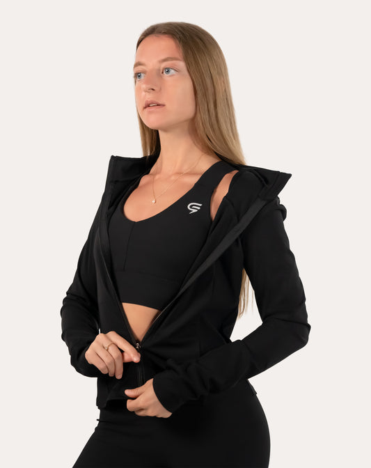 Women’s black gym jacket, front view showing the full-zip front and stand collar