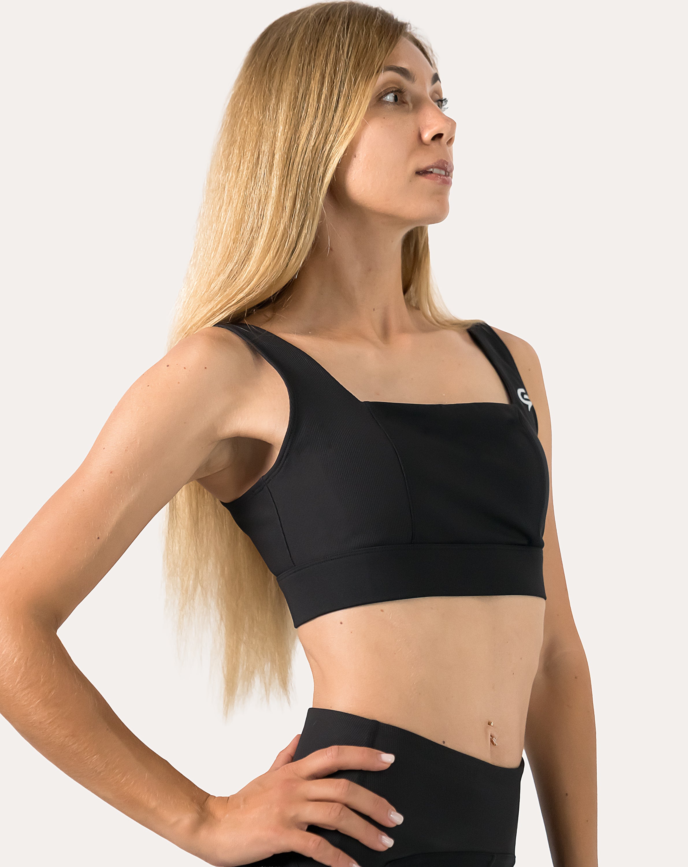 Close-up of black womens gym set bra showing square neckline and breathable straps