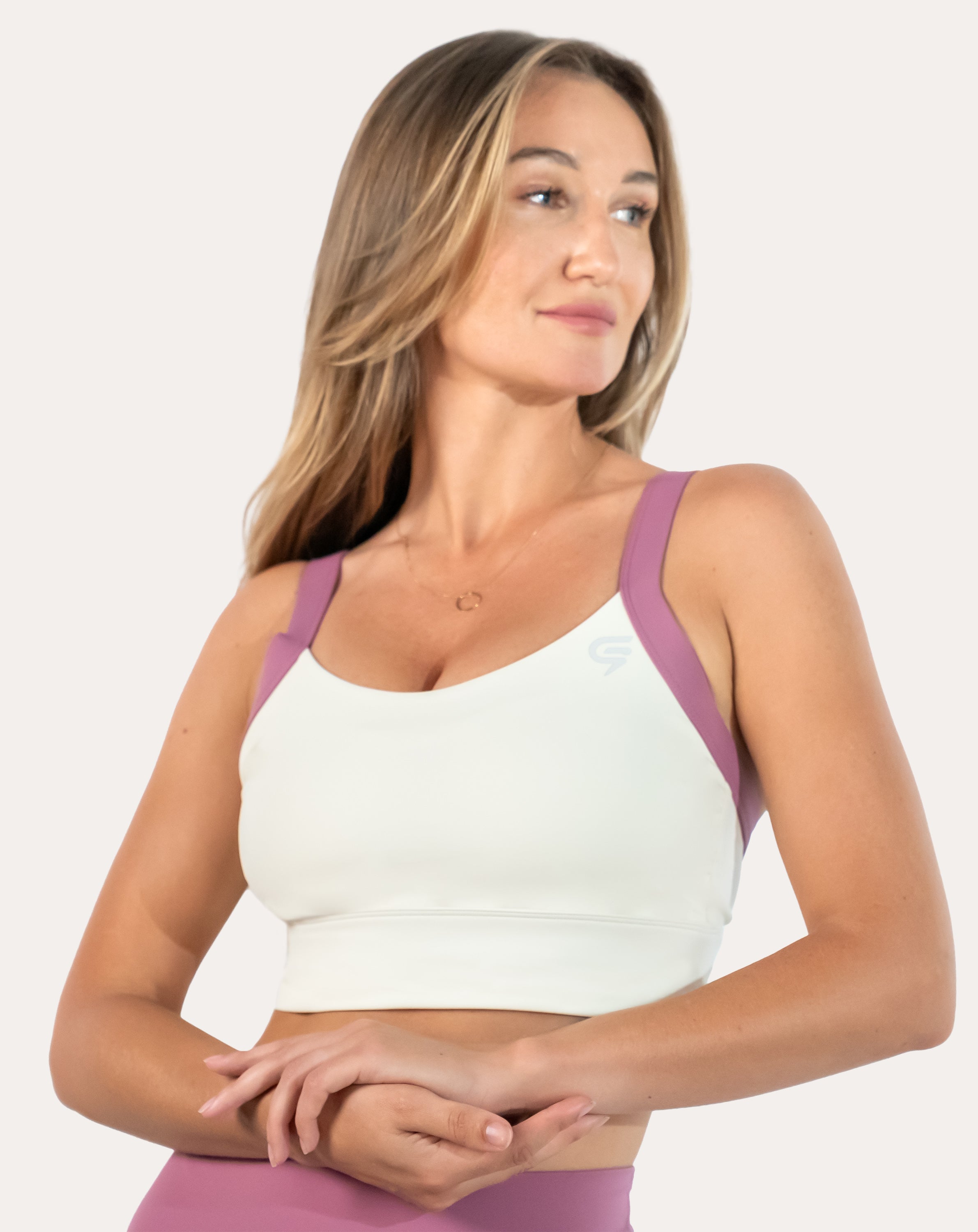 Front close-up of white/lilac women’s sports bra highlighting longline underband