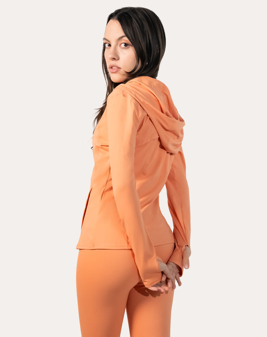 Apricot women’s zip-up jacket, right side profile with hood up