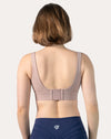Back view of baby pink sports bra showing hook-and-eye closure and U-back