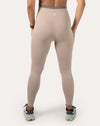 Back close-up of beige leggings showing the high-waist band, gusset, and smooth seams