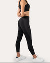 Black gym leggings with high-waist, 7/8 length; back three quarter view showing sculpting fit