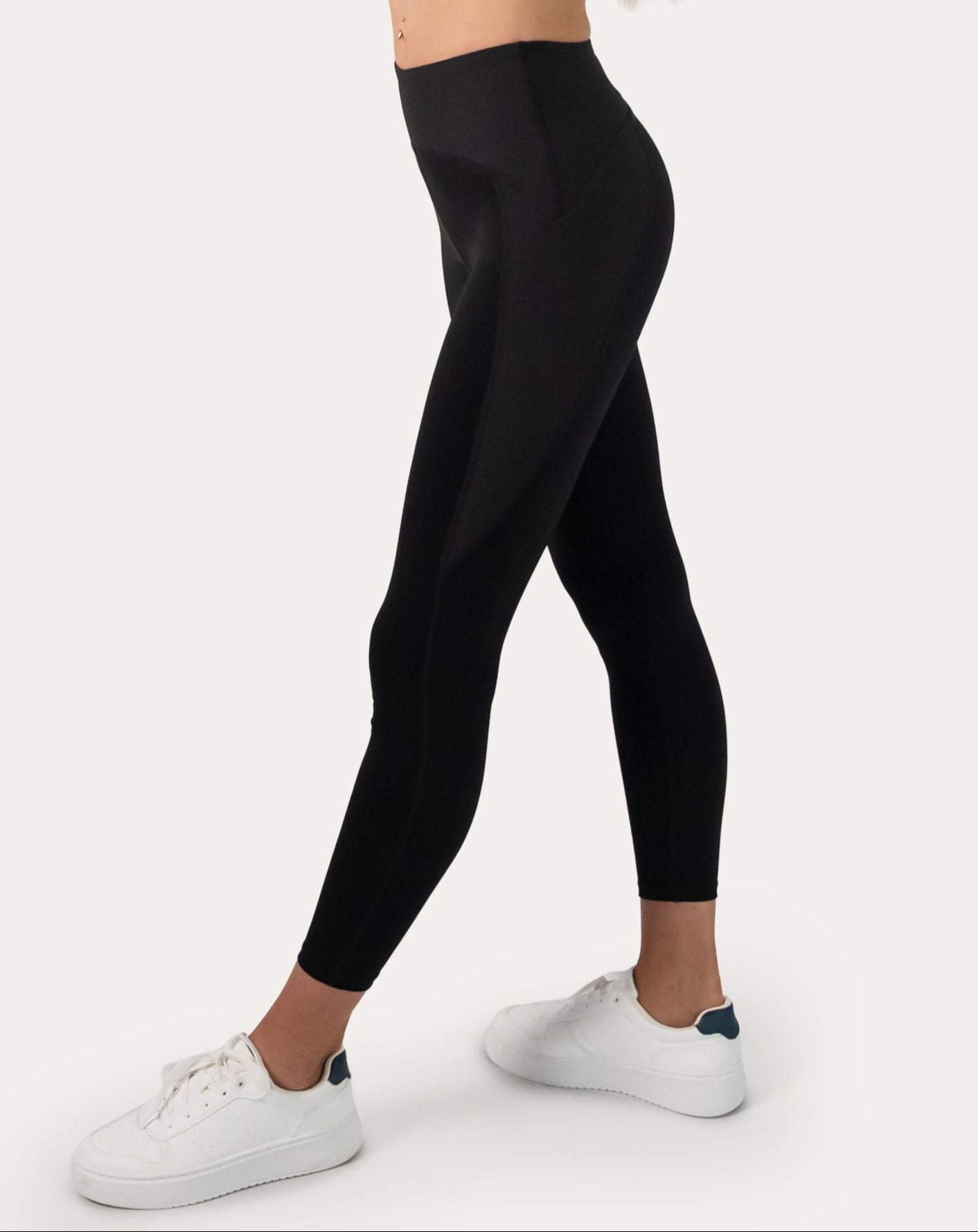 Black gym leggings with high-waist, 7/8 length; left three quarter view