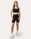 Front full-length view of black gym shorts set with seamless cross-back bra and high-waist shorts