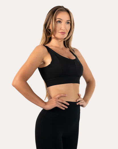 Front view of black high support sports bra with scoop neck, wide straps and smooth underband