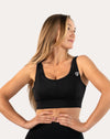 Right front three-quarter of black high support sports bra with scoop neck and wide straps