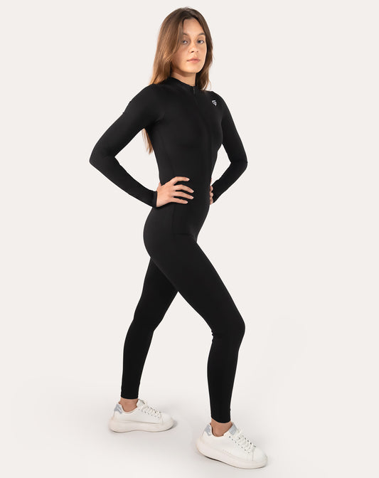 Front right three-quarter view of black long-sleeve women’s jumpsuit with zip neck