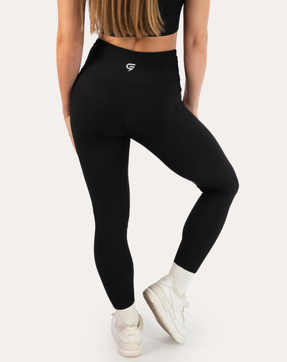 Black ribbed leggings with high-rise waistband; back left three quarter view