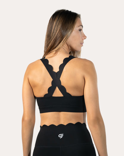 Back close-up of black seamless gym set bra with supportive cross-back straps