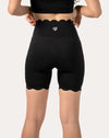 black-workout-shorts-scalloped-hem-back-close-up-right