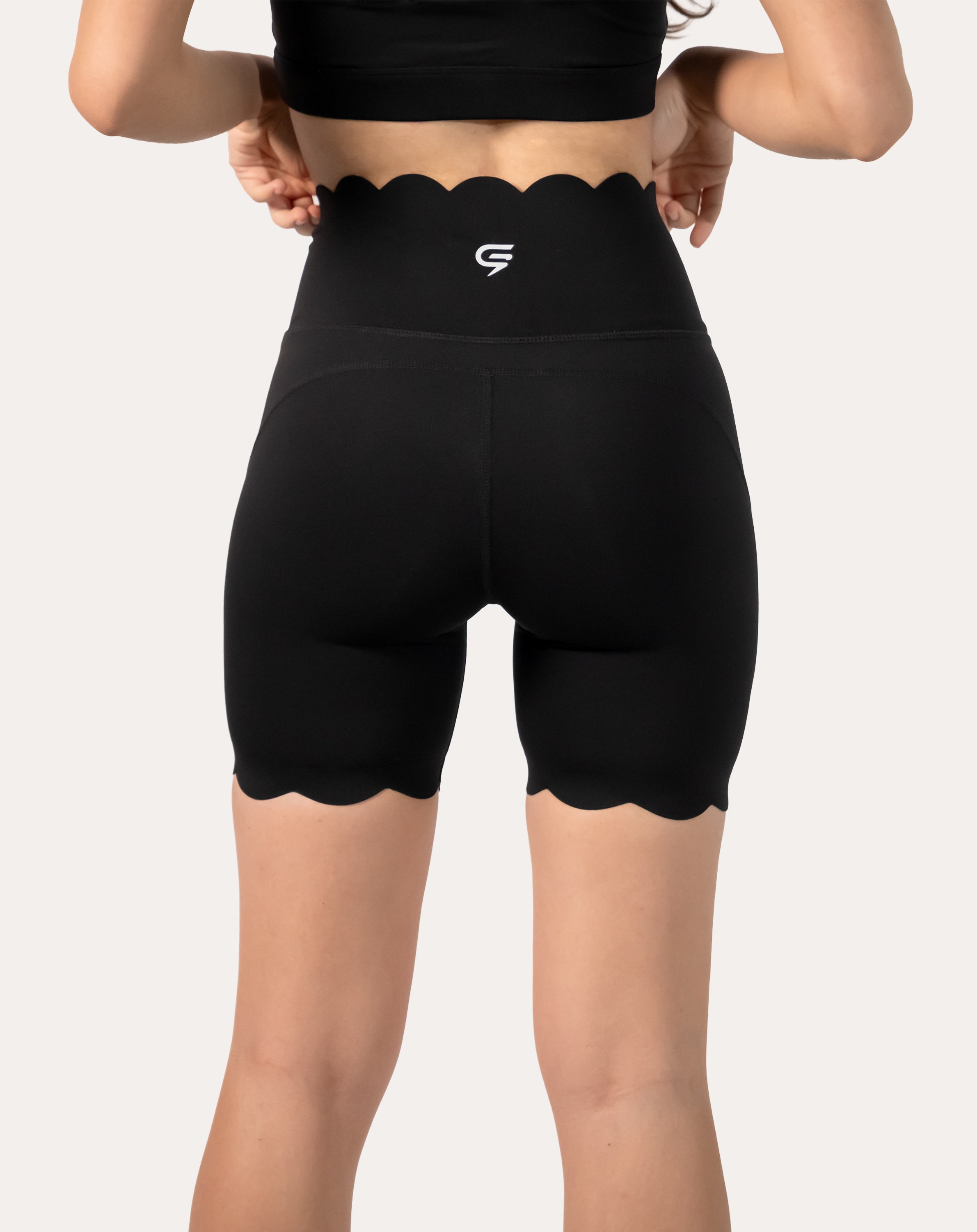 black-workout-shorts-scalloped-hem-back-close-up-right