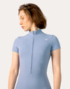 Blue sports jumpsuit with short sleeves; front left three quarter view showing seams