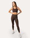 Cocoa brown gym set in three-quarter front pose showing fit of bra and leggings
