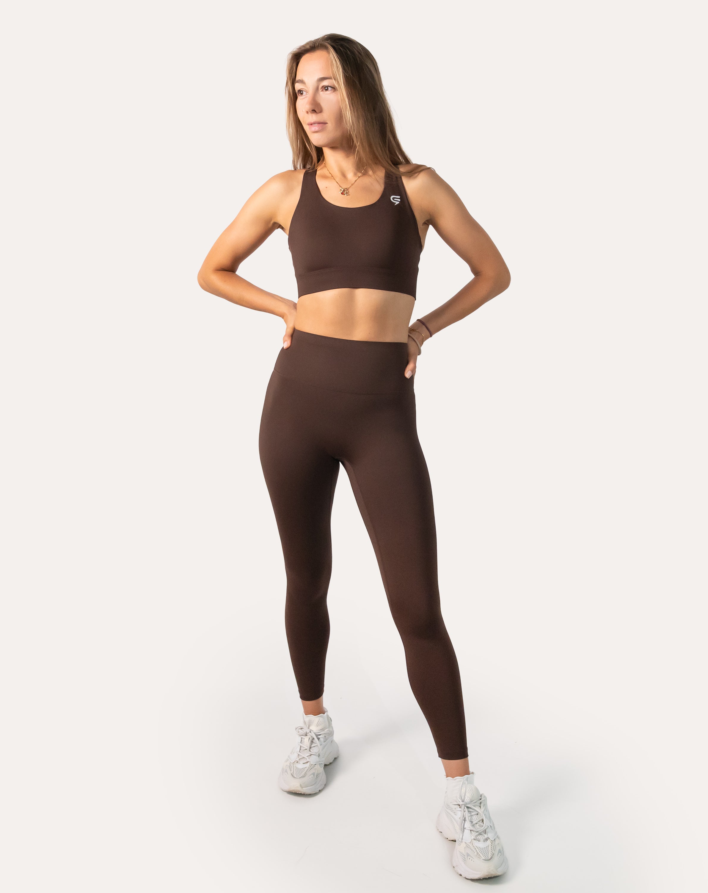 Cocoa brown gym set in three-quarter front pose showing fit of bra and leggings