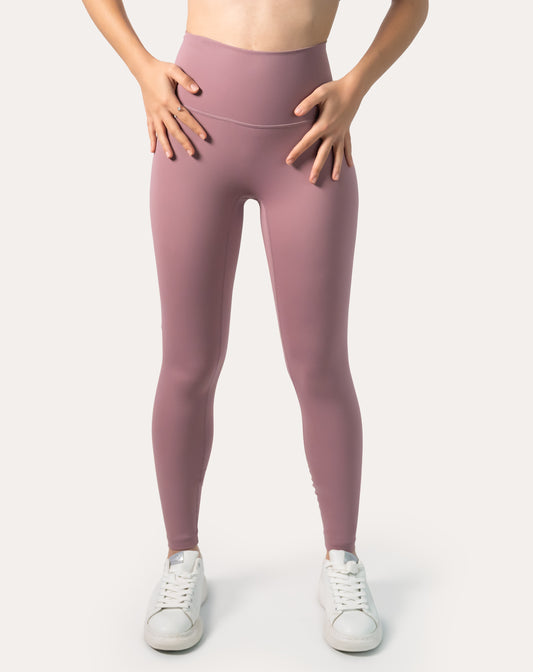 Front view of women’s high-waisted leggings in mauve pink; buttery-soft, second-skin finish with ankle-length fit