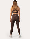 Chocolate brown sports leggings with high-rise waistband; back full-length view