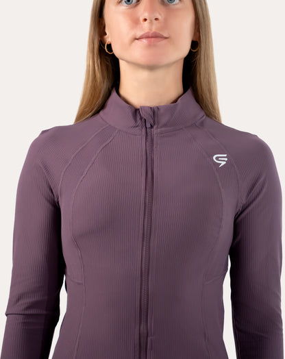Close-up of slate-lavender women’s training jacket showing stand collar and zipped front