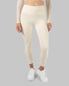 Leggings front detail on the cream long sleeve gym set, showing high waist fit and smooth seams