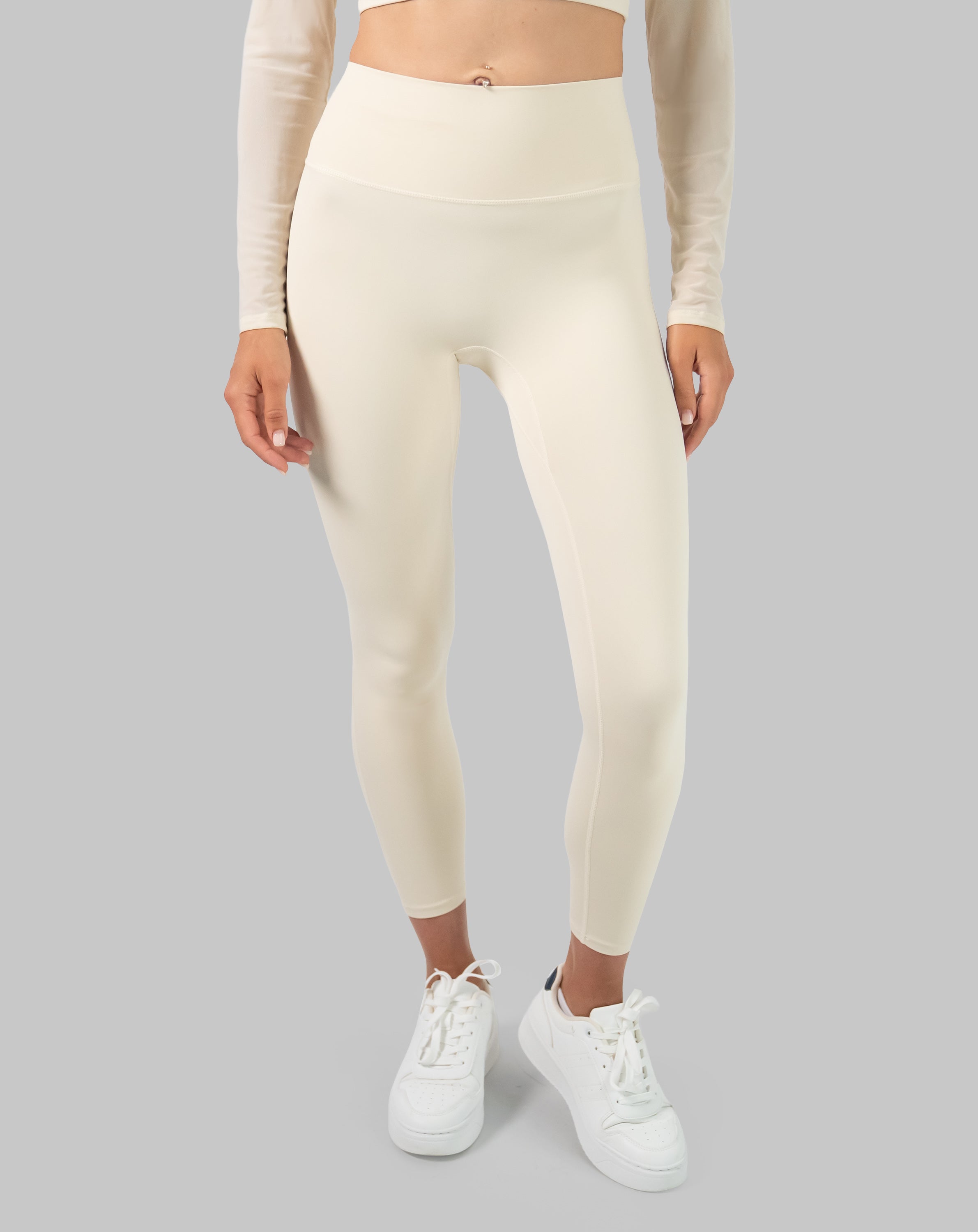 Leggings front detail on the cream long sleeve gym set, showing high waist fit and smooth seams