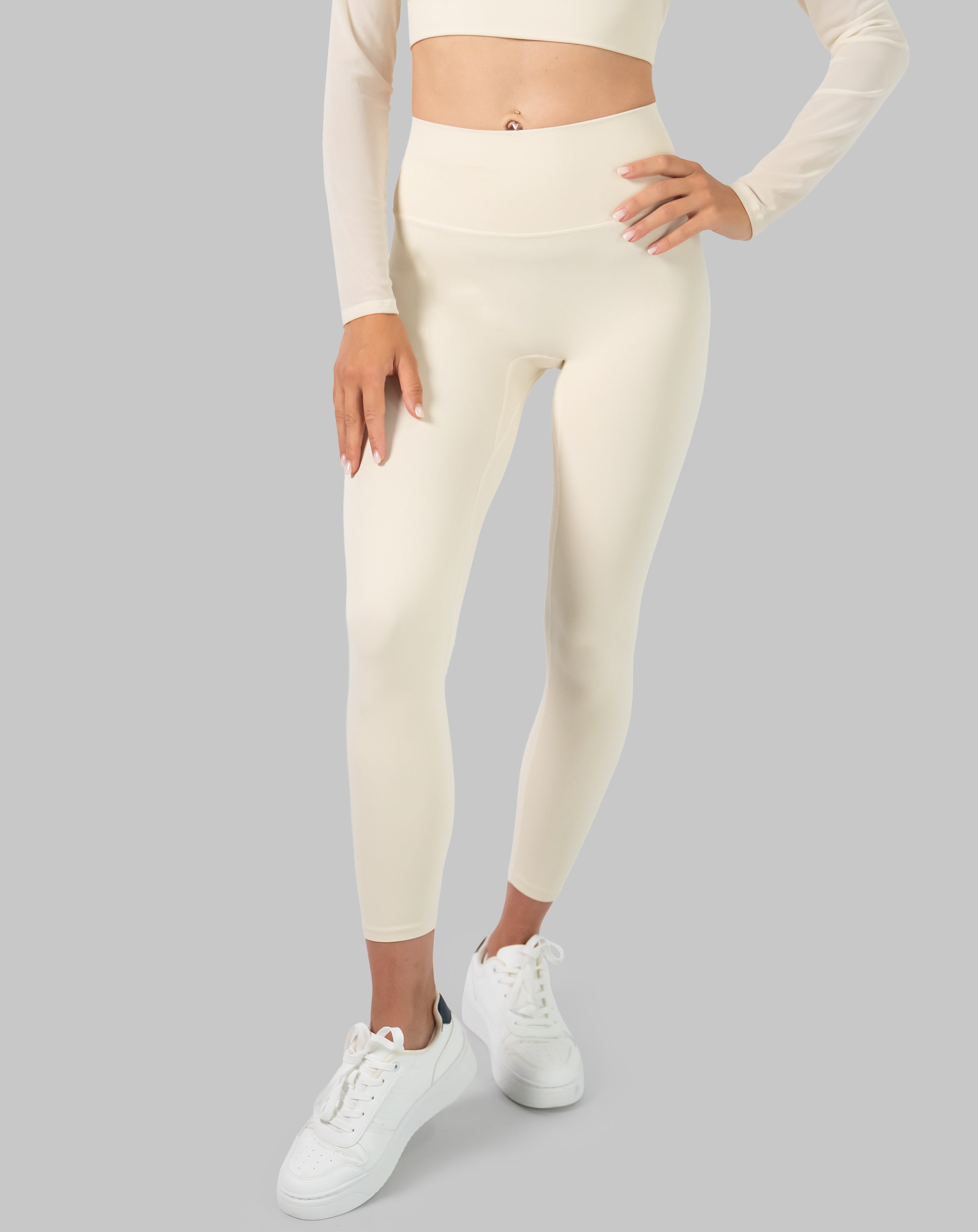 Front close-up of cream long sleeve gym set leggings highlighting the wide stay-put waistband