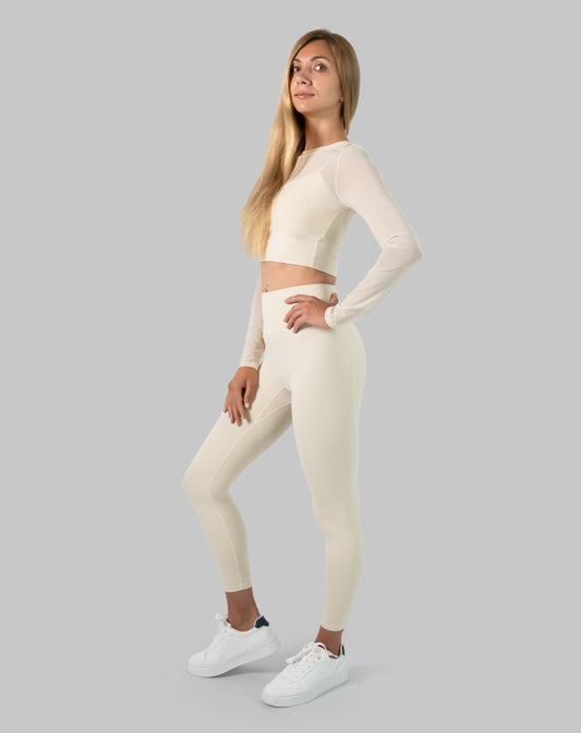 3/4 front of cream long sleeve gym set with breathable mesh crop and high waist leggings