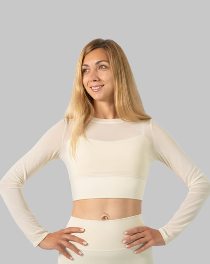 Waist-up view of cream long sleeve gym set, breathable mesh crop layered over supportive top