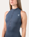 Deep blue women’s jumpsuit; close-up of the zip front and collar