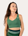 Front mid-length view of the forest green longline sports bra with smooth V-neck and wide underband