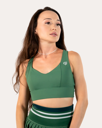 Front mid-length view of the forest green longline sports bra with smooth V-neck and wide underband