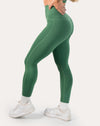 Forest green leggings with scallop high-waist, ankle length; left three quarter view