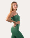 Green leggings with scallop high-waist; right side view, hands on hips
