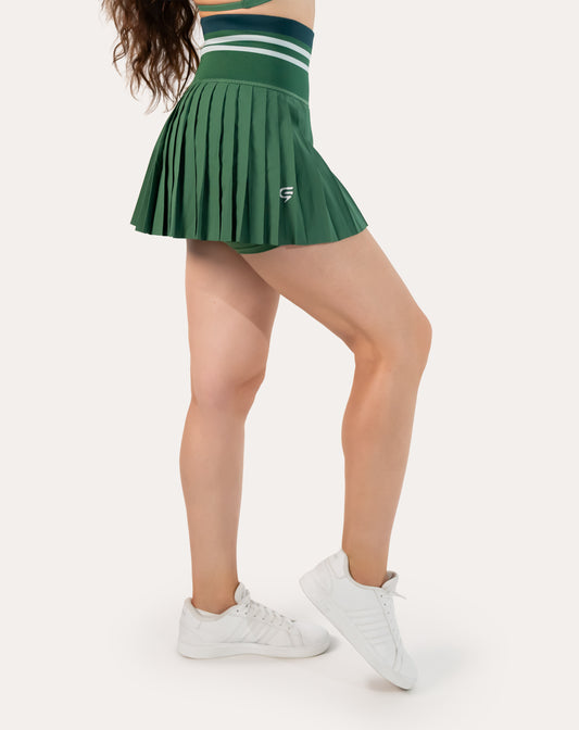 Front three-quarter close-up of forest green pleated tennis skirt with high-waist striped band