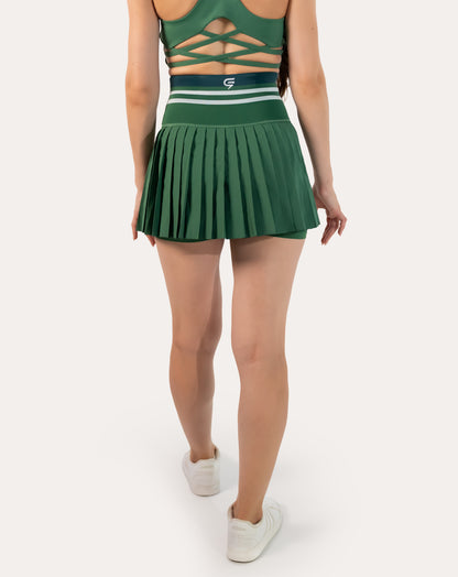 Full-body back view of forest green pleated tennis skirt with striped high-waist band