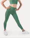 Front full-body view of women’s green ribbed high-waisted leggings with matching top; ankle-length, gym-ready