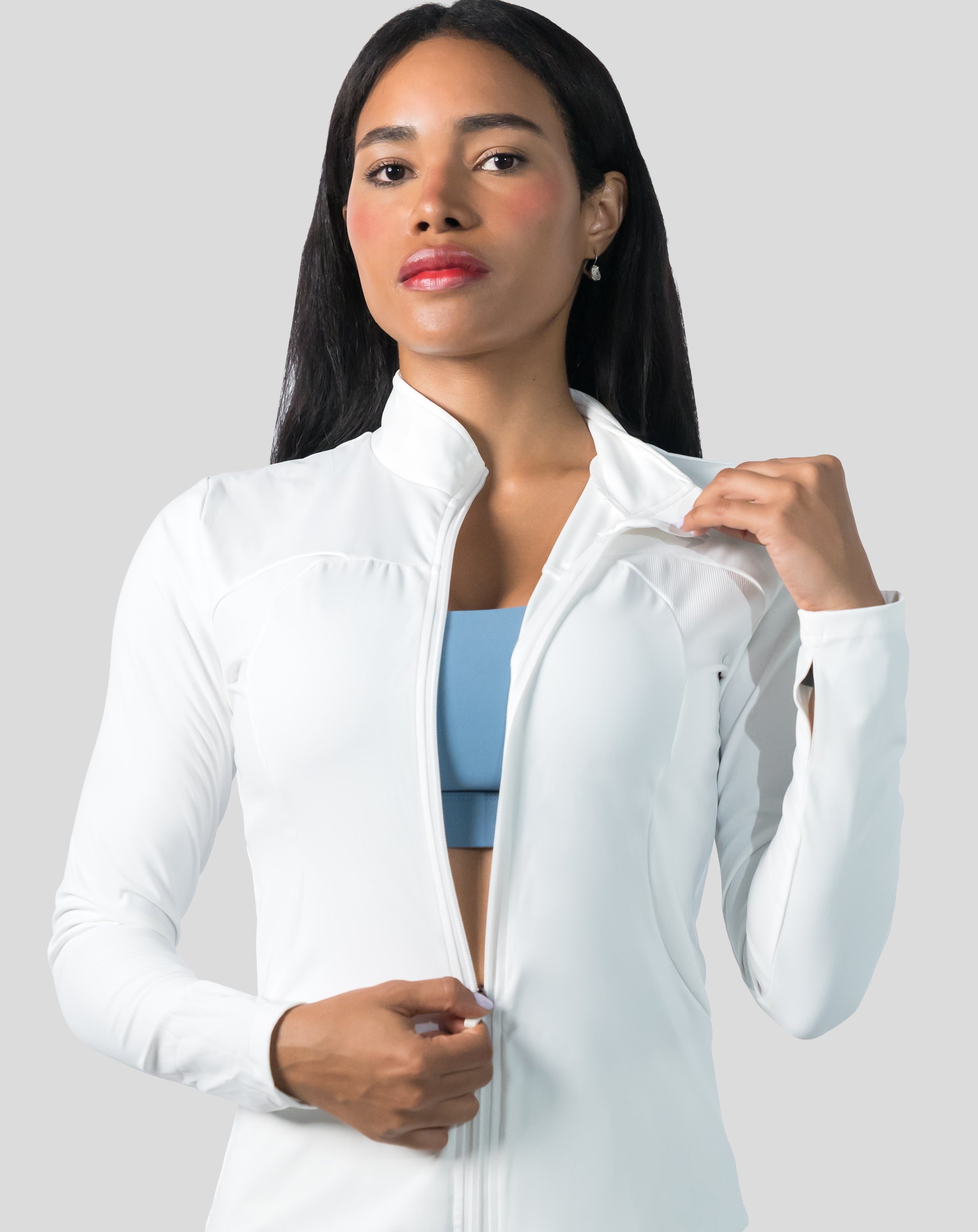 Arctic white gym jacket for women, front portrait with zip fully up and stand collar