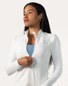 Arctic white gym jacket for women, front three-quarter view with zip being adjusted