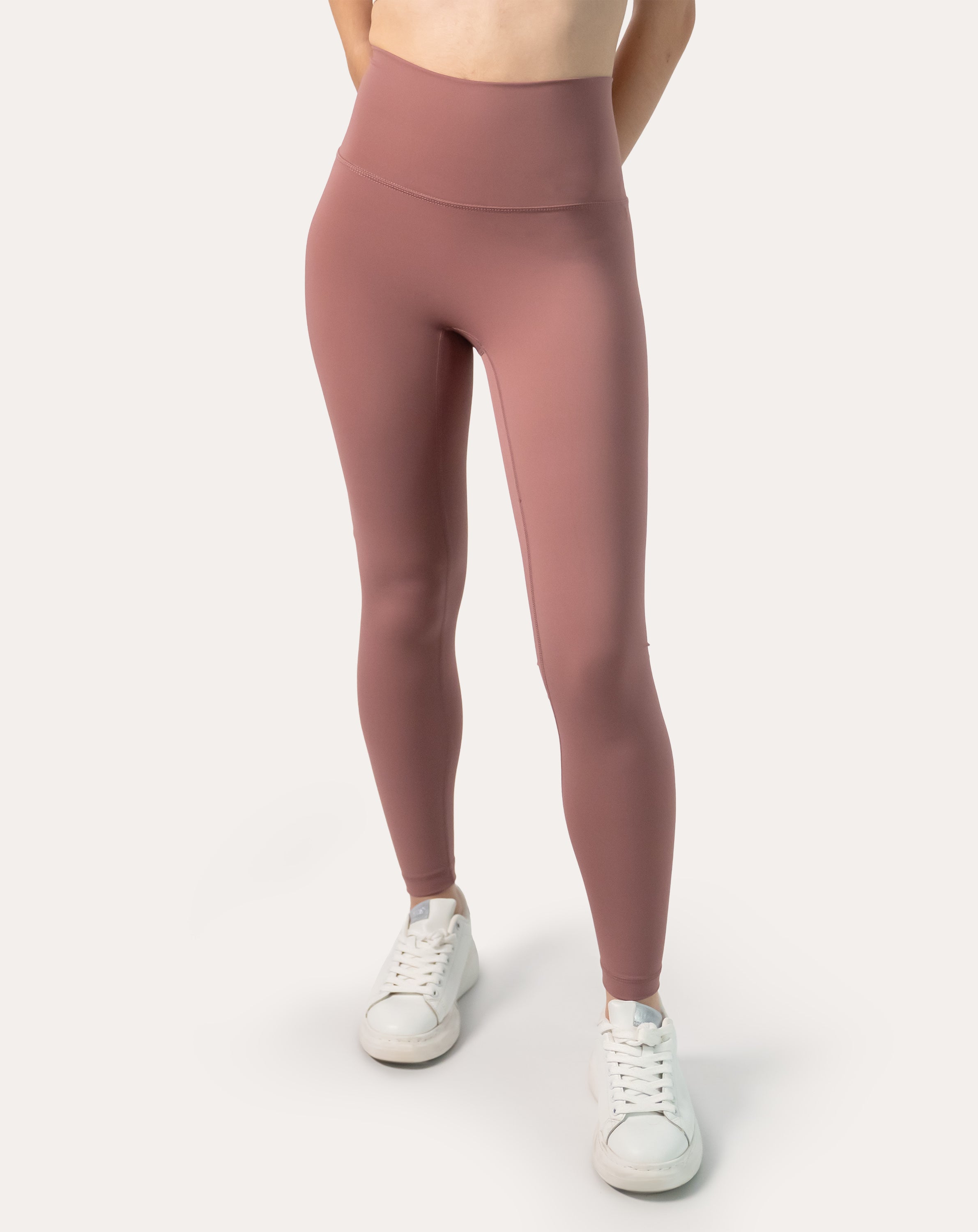 Full-length front shot of women’s rose-clay high-waisted leggings; sleek second-skin look and ankle-length hem