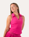 Close-up of hot pink gym set collared V neck tank with ribbed texture.