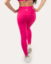 Hot pink running leggings with pockets; back full-length view