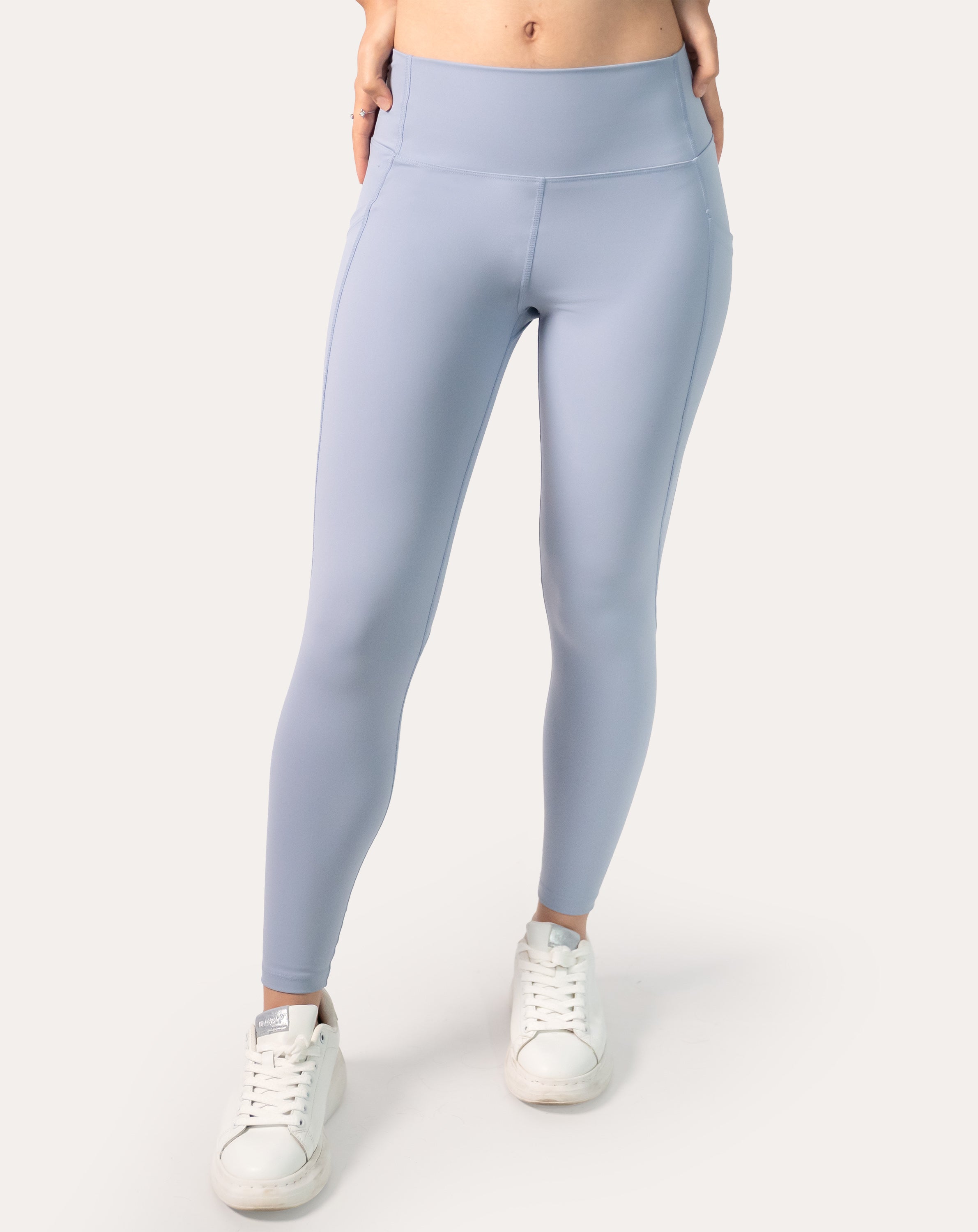 Cropped front view of ice blue leggings with phone pocket and smooth front panel