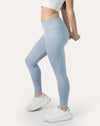 Left three-quarter view of ice blue leggings with phone pocket and high waist